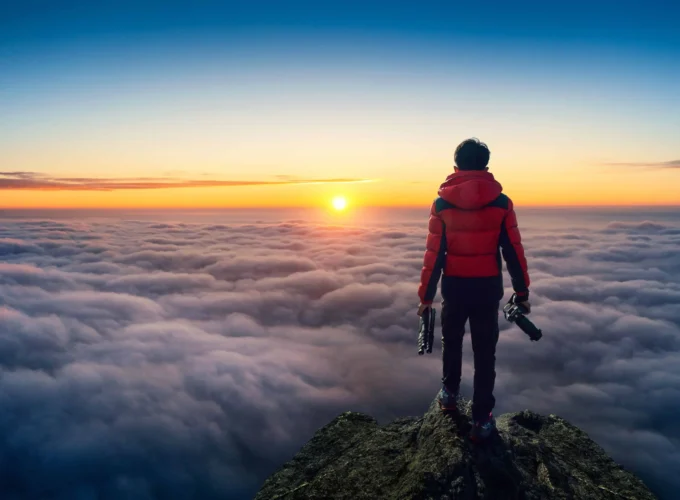 A tourist holding camera at viewpoint of Littele adam's peak ella Sri Lanka during Express Sri Lanka 7-Day Round Tour