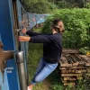 A girl Haggin on Train - Tourism Activities In Sri Lanka